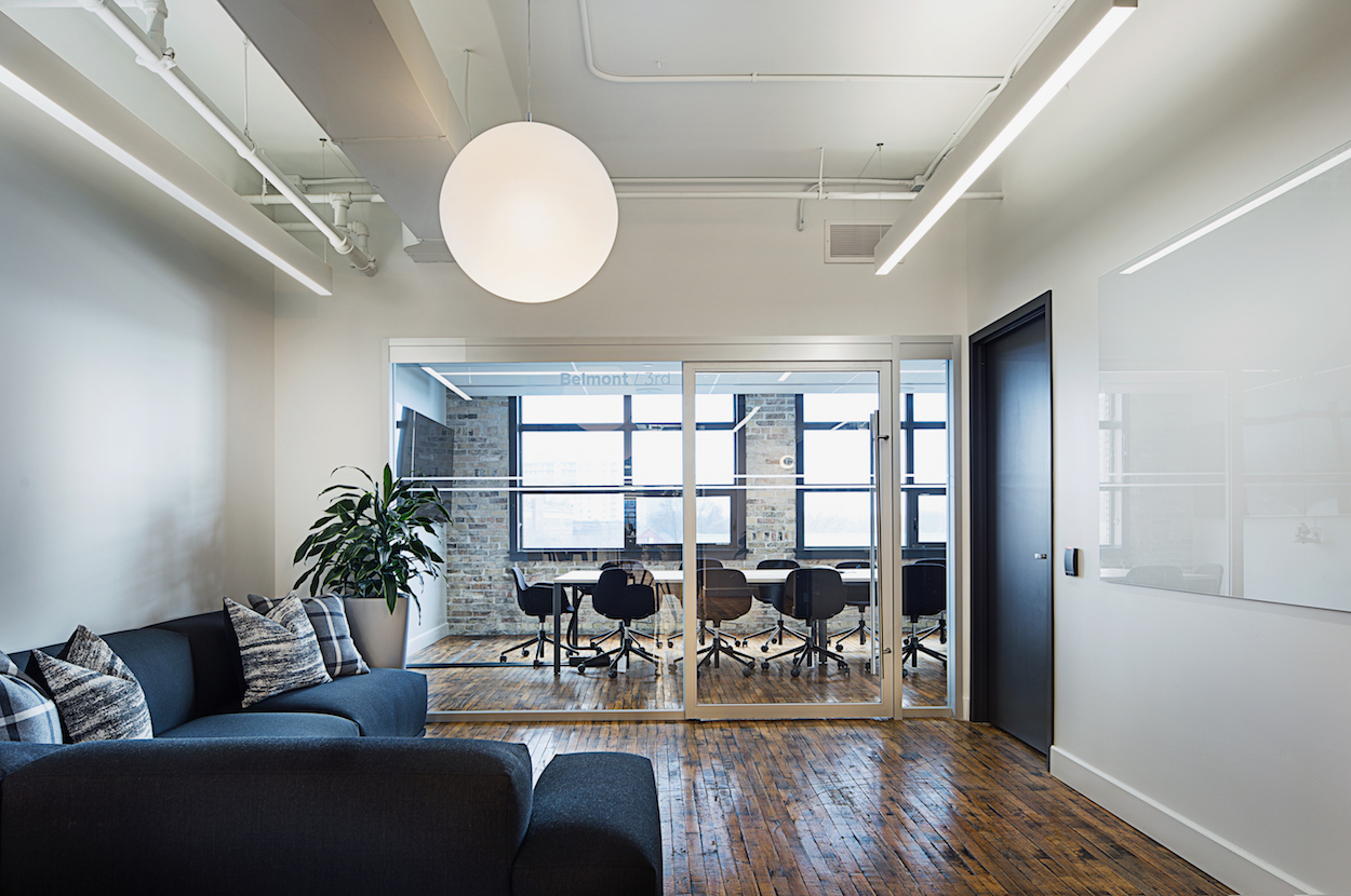 Refinished hardwood floors in a comfortable lounge.